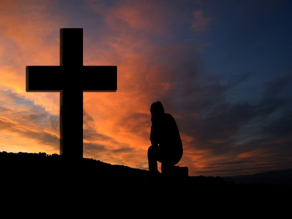 Prière devant une croix